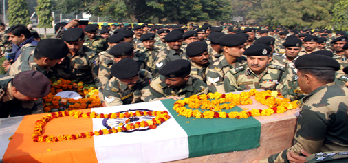 Coffin carrying body of martyr BSF jawan being shifted to his residence with full military honours in Jammu on Thursday. -Excelsior/Rakesh