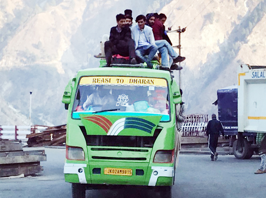 An overloaded minibus on Reasi road.