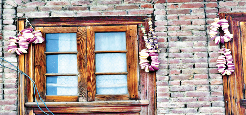 Dried vegetables hang on the wall of a house in Srinagar. -Excelsior/Shakeel