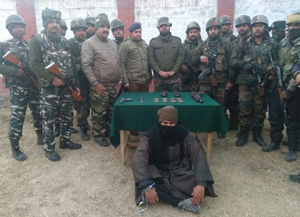 OGW arrested with arms and ammunition in Pattan on Wednesday. —Excelsior/Abid Nabi OGW arrested with arms and ammunition in Pattan on Wednesday. —Excelsior/Abid Nabi