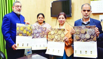 Finance Minister, Haseeb A Drabu and MoS for Culture, Priya Sethi unveiling Heritage Calendar -2018 at Jammu on Tuesday. Finance Minister, Haseeb A Drabu and MoS for Culture, Priya Sethi unveiling Heritage Calendar -2018 at Jammu on Tuesday.