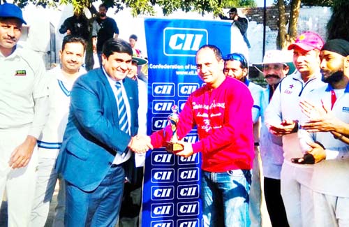 Former Ranji Trophy Player Rakesh Koul being presented man of the match award by Rahul Sahai, Chairman CII J&K State Council. Former Ranji Trophy Player Rakesh Koul being presented man of the match award by Rahul Sahai, Chairman CII J&K State Council.
