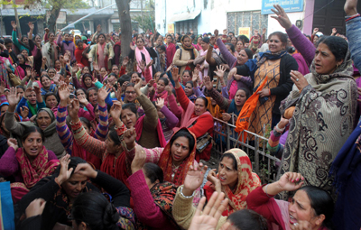 Anganwari workers and helpers during a protest near Press Club, Jammu on Thursday. — Excelsior/Rakesh Anganwari workers and helpers during a protest near Press Club, Jammu on Thursday. — Excelsior/Rakesh