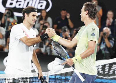 Roger Federer of Switzerland shakes hands with Tomas Berdych of Czech Republic after beating him in Australian Open Quarterfinals in Melbourne, Australia. Roger Federer of Switzerland shakes hands with Tomas Berdych of Czech Republic after beating him in Australian Open Quarterfinals in Melbourne, Australia.