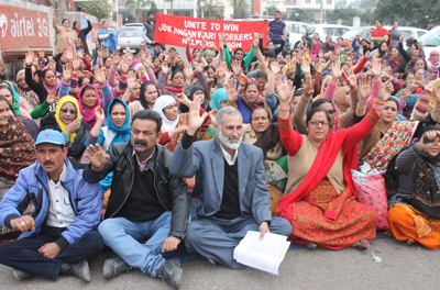 Anganwari workers and helpers staging a sit-in protest in front of Divisional Commissioner office. — Excelsior/Rakesh Anganwari workers and helpers staging a sit-in protest in front of Divisional Commissioner office. — Excelsior/Rakesh