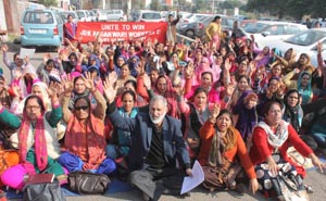 Anganwadi workers and helpers raising slogans during protest at Jammu on Monday. -Excelsior/Rakesh Anganwadi workers and helpers raising slogans during protest at Jammu on Monday. -Excelsior/Rakesh