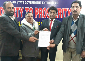 Balbir Ram Rattan VC of SC, ST & BC Corporation displaying an education loan letter to be given to a SC student undergoing engineering training in Punjab at Corporation Office at Jammu on Wednesday. Balbir Ram Rattan VC of SC, ST & BC Corporation displaying an education loan letter to be given to a SC student undergoing engineering training in Punjab at Corporation Office at Jammu on Wednesday.