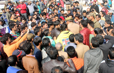 Stranded Kashmiri passengers protest at Jammu Bus Stand on Thursday. Stranded Kashmiri passengers protest at Jammu Bus Stand on Thursday.