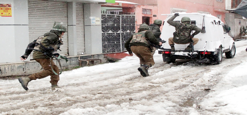 Security personnel taking position at Karan Nagar, Srinagar during encounter on Monday. (UNI) Security personnel taking position at Karan Nagar, Srinagar during encounter on Monday. (UNI)
