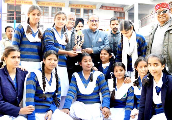 Deputy Chief Minister Dr Nirmal Singh presenting an award to a student of Bhartiya Shiksha Samiti on Wednesday.