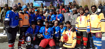 Ice Hockey champions posing for a group photograph along with dignitaries in Drass. Ice Hockey champions posing for a group photograph along with dignitaries in Drass.