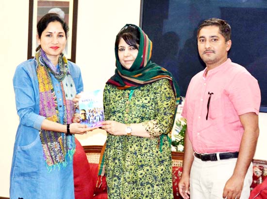 Chief Minister Mehbooba Mufti being presented book on women cricket by Roopali Slathia in Jammu. Chief Minister Mehbooba Mufti being presented book on women cricket by Roopali Slathia in Jammu.