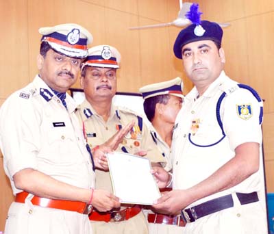 CRPF ADG VSK Kaumudi honouring a CRPF official in Jammu on Monday. CRPF ADG VSK Kaumudi honouring a CRPF official in Jammu on Monday.