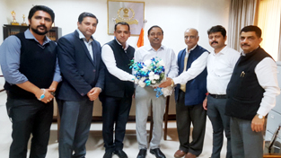 The office bearers of J&K Branch of NIRC of the ICAI presenting bouquet to Principal Commissioner of Income Tax, J&K RN Sahay during a meeting at Jammu.