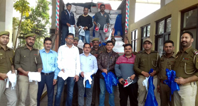 Sleuths of Excise Department showing seized polythene bags. Sleuths of Excise Department showing seized polythene bags.