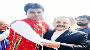 Newly sworn in Chief Minister of Tripura, Biplab Kumar Deb reaching out to Union Minister Dr Jitendra Singh for a jubilant hug, soon after the oath ceremony at Agartala on Friday. Newly sworn in Chief Minister of Tripura, Biplab Kumar Deb reaching out to Union Minister Dr Jitendra Singh for a jubilant hug, soon after the oath ceremony at Agartala on Friday.