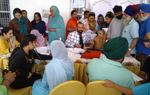 HoD Cardiology Dr Sushil Sharma examining patients at Gangyal on Sunday. HoD Cardiology Dr Sushil Sharma examining patients at Gangyal on Sunday.