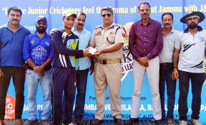 Former International Wrestler & SP Rural, Dushyant Sharma presenting man of the match award to Aqib of KC Royals at KC Sports Club in Jammu.