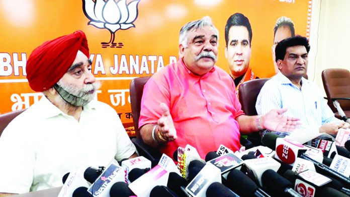 BJP leaders at a press conference at Jammu on Monday. -Excelsior/ Rakesh