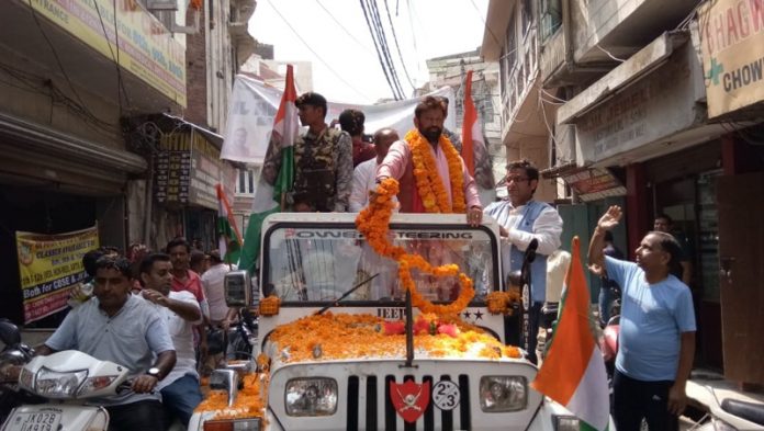 Ex-MP Ch Lal Singh taking out large rally in Jammu on Friday. -Excelsior/Rakesh