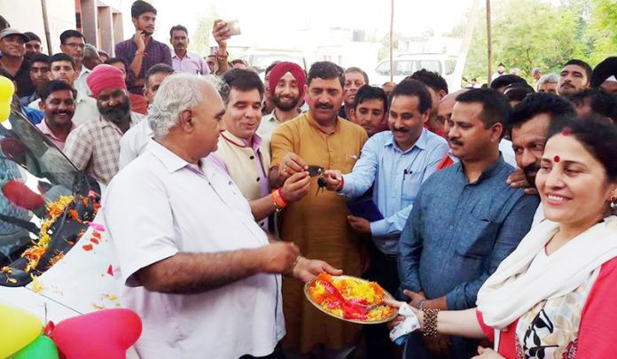 MP Jugal Kishore Sharma handing over keys of ambulance to villagers of Balshama in Nowshera.