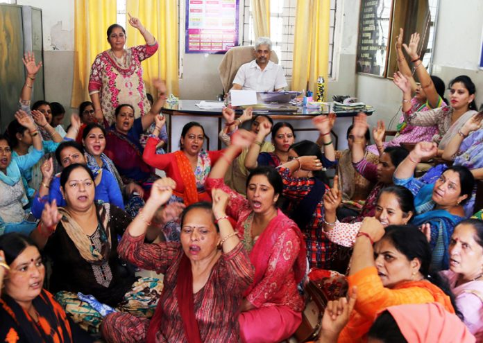 Female Multipurpose Health Workers staging protest in office chamber of Deputy CMO Jammu.