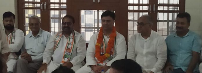 DCC president Vikram Malhotra along with other members at a meeting in Janipur on Monday.