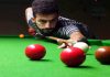 Cueist aiming at target during Six Red Balls Tournament at Billiards Hall, MA Stadium in Jammu. —Excelsior/Rakesh