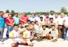 Winning team of Inter-Collegiate Kho-Kho Tournament posing along with dignitaries and officials in Jammu.