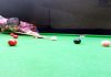Cueist in action at Billiards Hall, MA Stadium in Jammu.