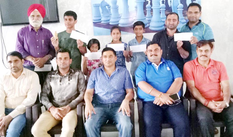 Chess champs posing along with Atul Gupta and other dignitaries in Jammu on Sunday. Chess champs posing along with Atul Gupta and other dignitaries in Jammu on Sunday.