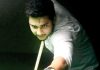 Cueist in action at Billiards Hall, MA Stadium in Jammu. -Excelsior/ Rakesh