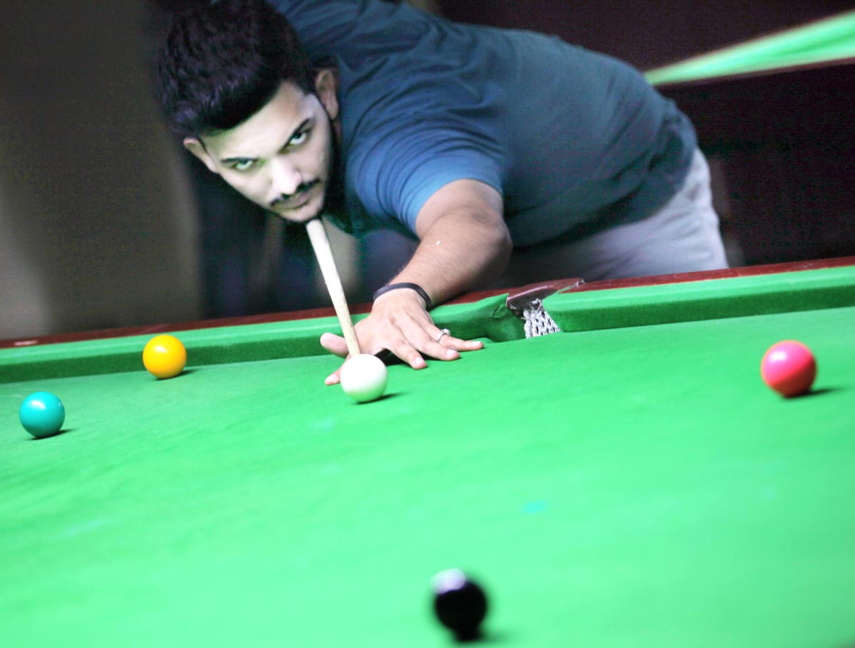 Cueist aiming at target in Junior Snooker Championship at Billiards Hall, MA Stadium in Jammu. -Excelsior/Rakesh Cueist aiming at target in Junior Snooker Championship at Billiards Hall, MA Stadium in Jammu. -Excelsior/Rakesh