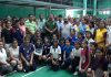 Young shuttlers posing along with dignitaries and officials during the inaugural ceremony of Inter-Collegiate Badminton Tournament.