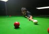 Cueist aiming at target during a match of 26th State Senior Billiards and Snooker Championship in Jammu. —Excelsior/Rakesh