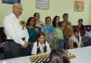Winners of Inter-School Chess Championship posing along with dignitaries and officials.