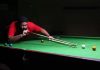 Cueist aiming at target during a match of Junior Snooker Championship in Jammu. -Excelsior/ Rakesh
