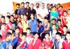 Winners of 1st District Jammu Kalarippayattu Championship posing along with dignitaries and officials in Jammu.