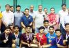 Dignitaries awarding the winner team of Badminton Championship.