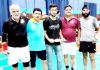 Shuttlers posing for a photograph during All India Jammu Masters Badminton Championship in Jammu.