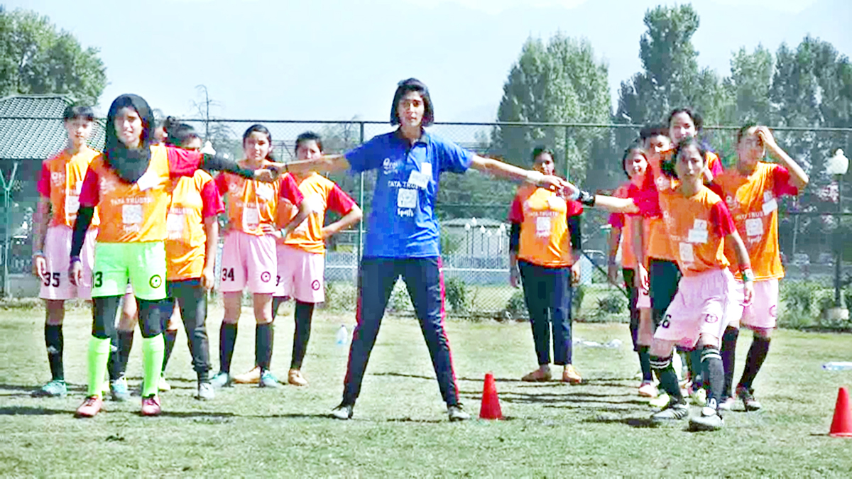 Girls being imparted football training by US-based trainers in Srinagar on Thursday. Girls being imparted football training by US-based trainers in Srinagar on Thursday.