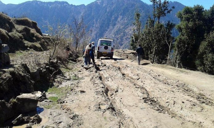 A vehicle passing through dilapidated Thathri-Donadie-Bunjwah road which is in dilapidated condition. — Excelsior/Rafi Choudhary