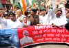 Congress leaders and activists staging protest march in Jammu on Wednesday. -Excelsior/Rakesh