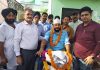 MLA Gandhi Nagar, Kavinder Gupta posing with a handicapped man after handing over a tri-scooter to him.