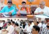 BJP leaders at a meeting at party headquarters in Trikuta Nagar on Friday.