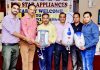 Neeraj Anand, President, Chamber of Traders Federation Jammu and officials of Red Star Company launching full range of geysers in Jammu.