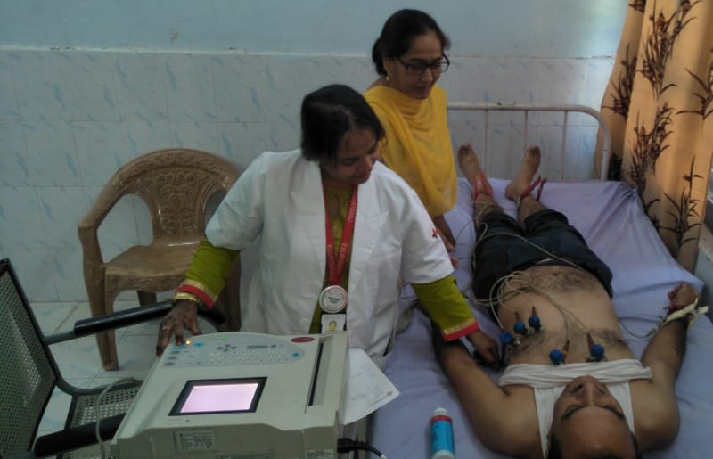 Doctors examining a patient at a multi specialty medical camp organized by Salal Power Station in Jyotipuram on Thursday. Doctors examining a patient at a multi specialty medical camp organized by Salal Power Station in Jyotipuram on Thursday.