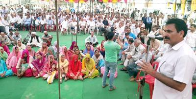 DCC Kathua president, Dr Manohar Lal Sharma addressing public meeting at Billawar on Tuesday. DCC Kathua president, Dr Manohar Lal Sharma addressing public meeting at Billawar on Tuesday.