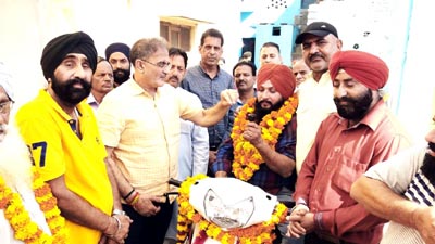Former Deputy CM and MLA Gandhi Nagar, Kavinder Gupta handing over a scooty to a differently abled person on Monday. Former Deputy CM and MLA Gandhi Nagar, Kavinder Gupta handing over a scooty to a differently abled person on Monday.
