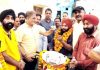 Former Deputy CM and MLA Gandhi Nagar, Kavinder Gupta handing over a scooty to a differently abled person on Monday.